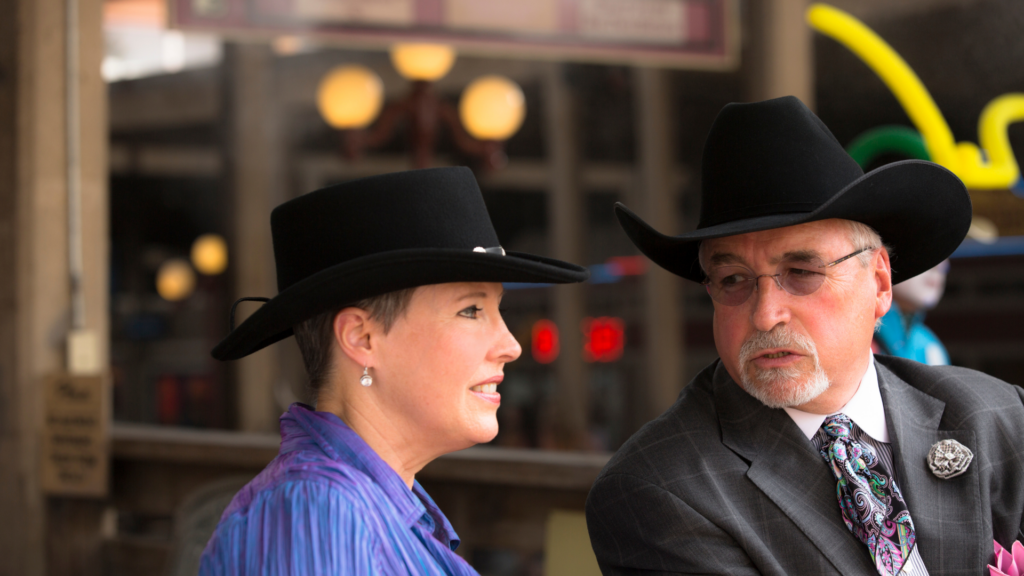 Image of cowboy and cowgirl in houston dressed in a suite.
